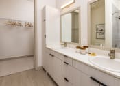 Thumbnail 4 of 23 - Double sink bath vanity and large walk in closet at Zeta Luxury Apartments in Sacramento, CA