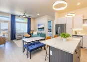 Thumbnail 1 of 23 - open concept living area with living room and kitchen at Zeta Luxury Apartments in Sacramento, CA