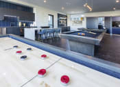 Thumbnail 11 of 23 - Social Lounge with Billiards, Shuffleboard, and Kitchenette at Zeta Luxury Apartments in Sacramento, CA