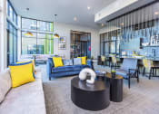 Thumbnail 9 of 23 - resident lounge great room with kitchen bar top seating at Zeta Luxury Apartments in Sacramento, CA