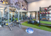Thumbnail 18 of 23 - 24 hour athletic center with weights and other exercise equipment at Zeta Luxury Apartments in Sacramento, CA