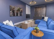 Thumbnail 13 of 23 - Media Lounge with comfortable seating at Zeta Luxury Apartments in Sacramento, CA