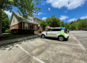 Thumbnail 3 of 10 - A Ticon Car parked outside of Highgate Townhomes.