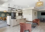 Thumbnail 15 of 29 - a resident clubhouse with a kitchen and dining area