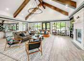 Thumbnail 1 of 35 - A modern living room with a fireplace and a large rug.