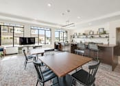 Thumbnail 27 of 35 - A modern dining room with a large table and chairs.