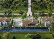 Thumbnail 11 of 12 - an aerial view of a large mansion with a pool in the middle of a grassy area