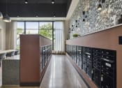 Thumbnail 19 of 26 - a room with a long counter filled with wine racks and a large window
