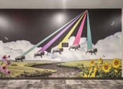 Thumbnail 23 of 26 - a wall mural of a herd of sheep flying through the sky