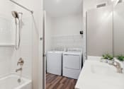 Thumbnail 26 of 35 - Mural-Model Unit Laundry