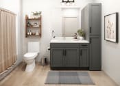 Thumbnail 9 of 12 - a bathroom with a gray vanity and a white toilet
