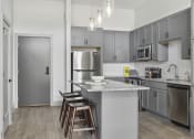Thumbnail 1 of 33 - Savor apartments 1 bedroom kitchen with grey cabinets