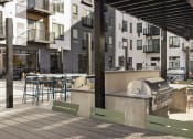 Thumbnail 11 of 33 - outdoor patio with grills at apartments in west saint paul MN
