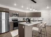Thumbnail 25 of 28 - A modern kitchen with a stainless steel refrigerator and white countertops.
