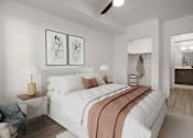 Thumbnail 15 of 28 - A bedroom with a large bed and two lamps.