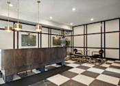 Thumbnail 1 of 49 - A black and white checkered floor in a room with a long wooden bench.