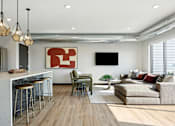 Thumbnail 33 of 49 - A modern living room with a bar area and a couch.