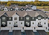 Thumbnail 27 of 49 - A large housing development with rows of houses.