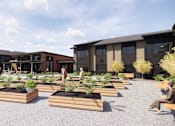 Thumbnail 2 of 5 - a rendering of a courtyard with wooden benches in front of apartment buildings
