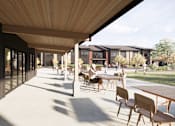 Thumbnail 3 of 5 - a patio with tables and chairs and buildings in the background