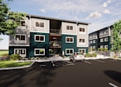 Thumbnail 4 of 4 - A modern apartment complex with a parking lot in front.
