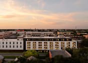 Thumbnail 2 of 24 - A modern building with a lot of windows is shown in the image at Miles at Ybor Apartments, Tampa