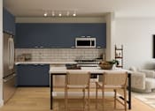 Thumbnail 2 of 6 - A kitchen with a table and chairs.