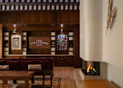 Thumbnail 4 of 19 - A cozy room with a fireplace and a sign that says "The Steeves".