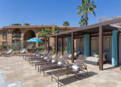 Thumbnail 10 of 25 - Poolside Relaxing Area at Medici Apartment Homes, Bermuda Dunes, 92203