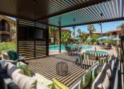 Thumbnail 11 of 25 - Shaded Lounge Area By Pool at Medici Apartment Homes, Bermuda Dunes, CA