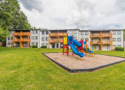 Thumbnail 29 of 35 - Playground with a slide at Pinewood Townhomes, Tucker, GA, 30084