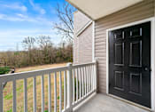 Thumbnail 29 of 29 - A black door is on the right side of a white railing at 2000 Oasis in Atlanta, GA 30316