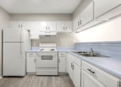 Thumbnail 18 of 29 - Kitchen with appliances at 2000 Oasis  Apartments, Atlanta, 30316
