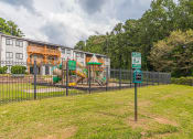 Thumbnail 34 of 35 - Fenced in playground at Pinewood Townhomes, Tucker, GA, 30084