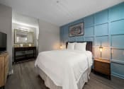 Thumbnail 18 of 60 - Furnished Bedroom with cozy bed and lamp set at the 505 Collection in Atlanta, Georgia.