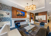 Thumbnail 5 of 24 - 1st Floor Social Lounge with Fireplace and Coffee Bar at ELEVATE Apartment Homes, Minneapolis
