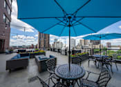 Thumbnail 16 of 24 - 7th Floor Sundeck Lounge and BBQ Area at ELEVATE Apartment Homes, Minneapolis