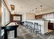 Thumbnail 31 of 36 - Clubhouse Kitchen at Maven Apartments, Burnsville, MN, 55337