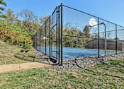 Thumbnail 30 of 33 - A black fence surrounds a blue pool.