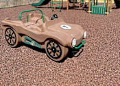 Thumbnail 30 of 33 - Playground at River Oaks at Rochester Hills Apartments featuring a toy car and green play structure.