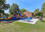 Thumbnail 42 of 43 - Outdoor playground and bbq area at Georgetown of St. Louis Apartments