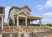 Thumbnail 31 of 51 - a house with a wooden fence in front of it