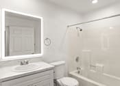 Thumbnail 16 of 36 - A white bathroom with a sink, toilet, and bathtub.
