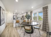 Thumbnail 4 of 51 - a kitchen and dining room with a table and chairs