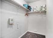 Thumbnail 7 of 45 - A white wall with a white doorbell and a white coat rack.