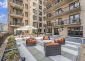 Thumbnail 24 of 29 - an outdoor lounge area at the bradley braddock road station apartments