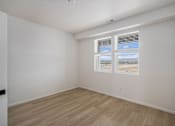Thumbnail 21 of 23 - A room with a window and a wooden floor. at Bloom Rental Living apartments in Fort Collins, CO.
