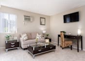 Thumbnail 10 of 27 - Living room at Navajo Bluffs Apartments