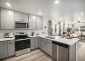 Thumbnail 2 of 51 - Kitchen with stainless steel appliances and quartz counter tops