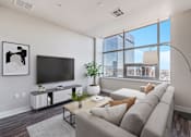 Thumbnail 29 of 33 - Living Room With TV at 1600 Glenarm Place, Denver